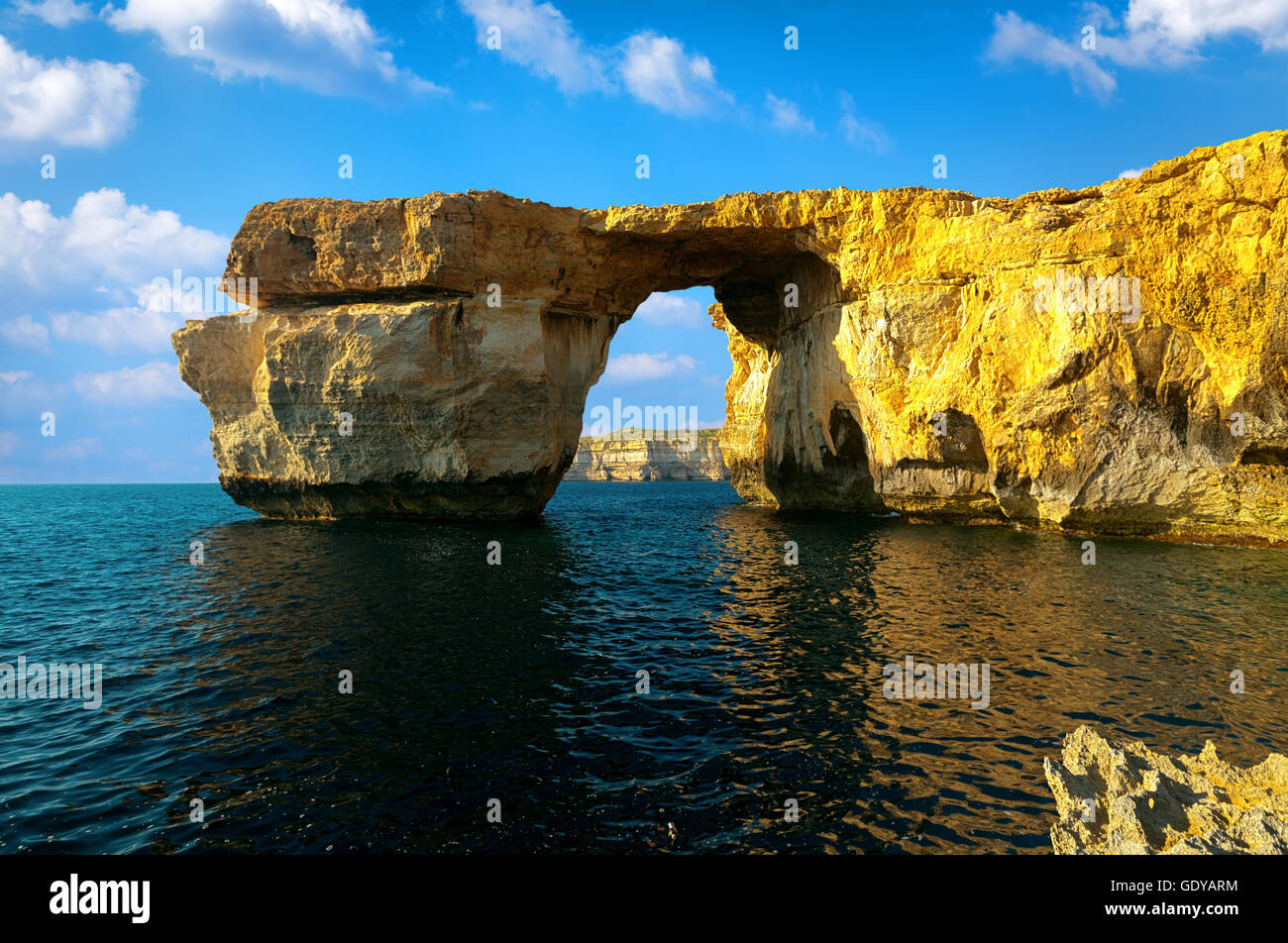 Azure Window, famous stone arch on Gozo island with reflection, Malta Stock Photo