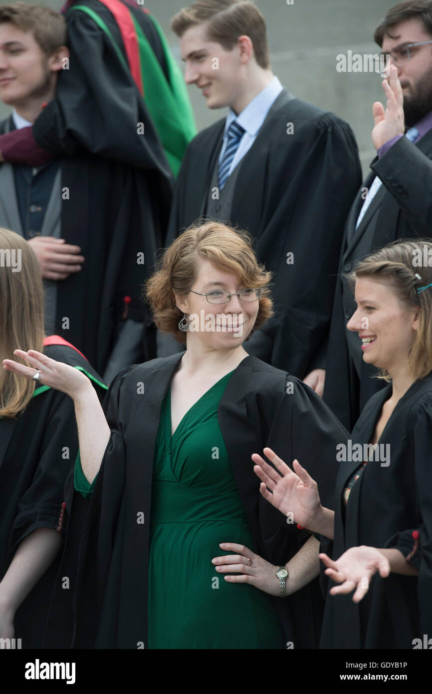 Higher Education in the UK: Aberystwyth university women students wearing traditional gowns, capes and mortar boards having fun at their graduation day ceremony, July  2016 Stock Photo
