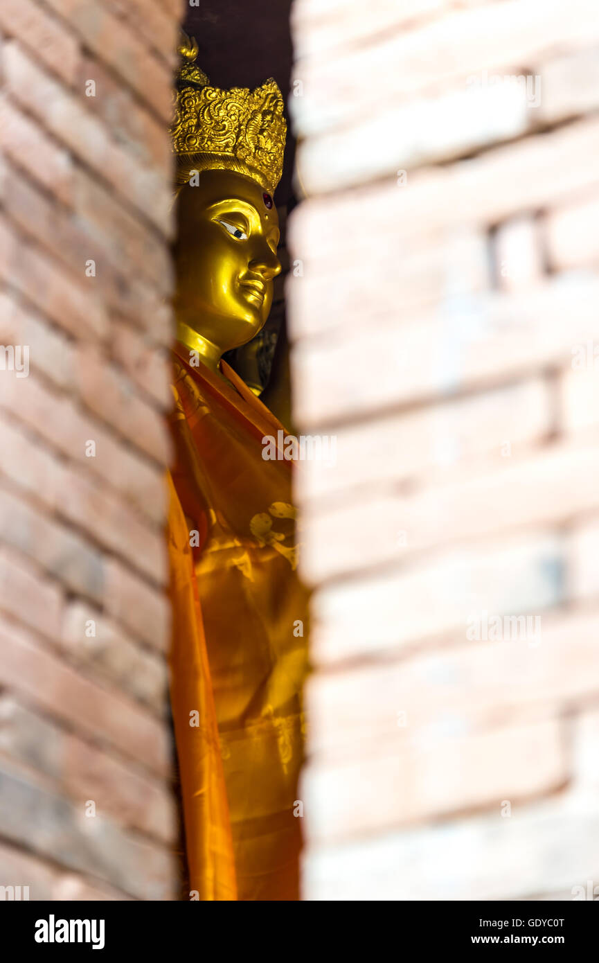 Golden Guanyin statue in Thai temple Stock Photo