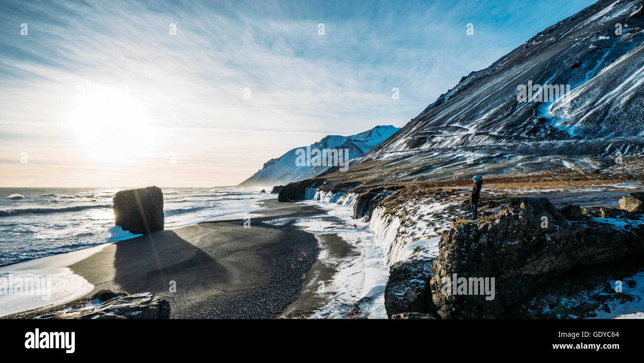 Sun shining over icy beach and mountains, Iceland Stock Photo