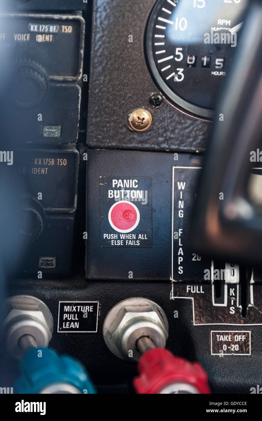 Close-up of red panic button in cockpit, Venezuela Stock Photo