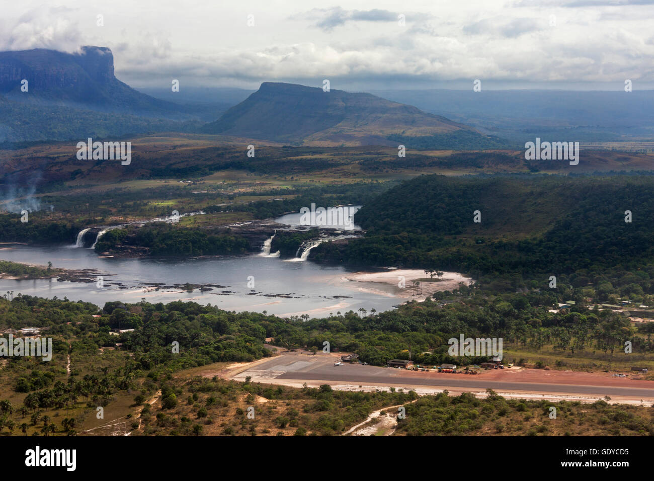 Aerial view of Canaima Lagoon waterfalls at river Carrao in Venezuela. Tepuis (table mountains) in the background Stock Photo