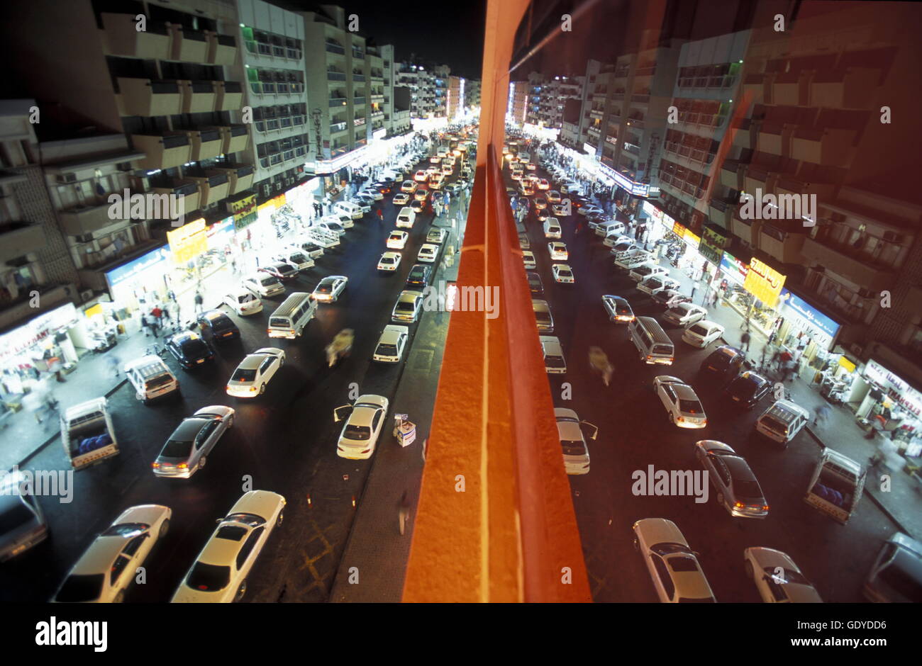 a road at night in the old town in the city of Dubai in the Arab Emirates in the Gulf of Arabia. Stock Photo