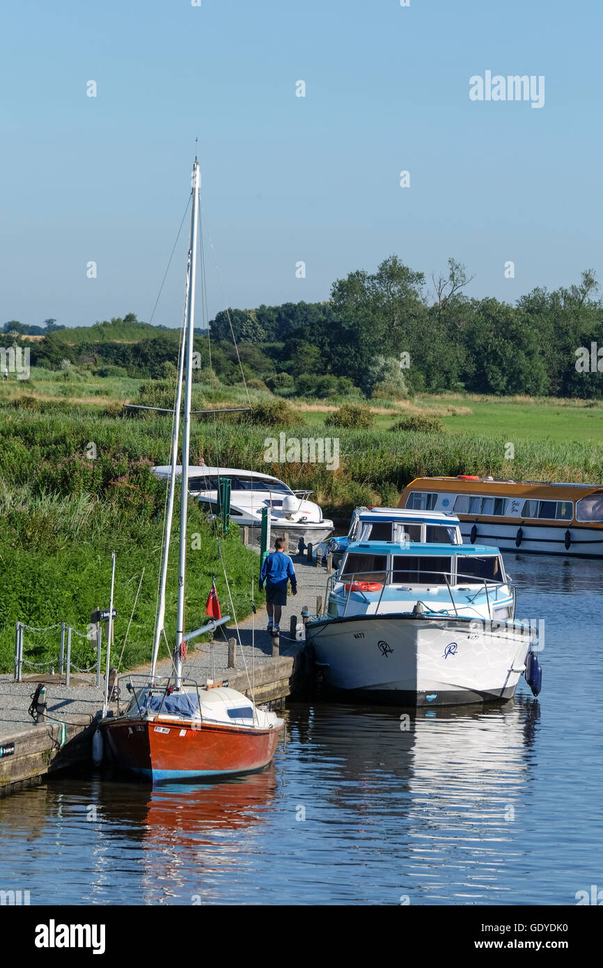 Boats moored at Ludham Bridge in the Norfolk Broads Stock Photo