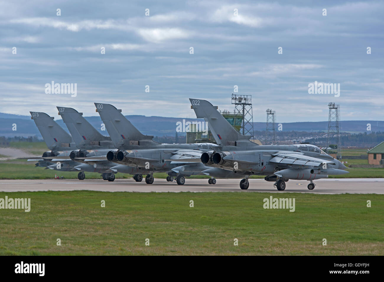 An RAF GR4 Tornado on the perimeter taxiway at the Lossiemouth home base in Scotland.  SCO 10,760. Stock Photo