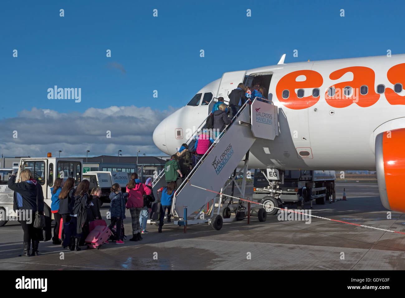 Passengers boarding an Easy jet flight hopefully heading for a sunshine holiday.  SCO 10,770. Stock Photo