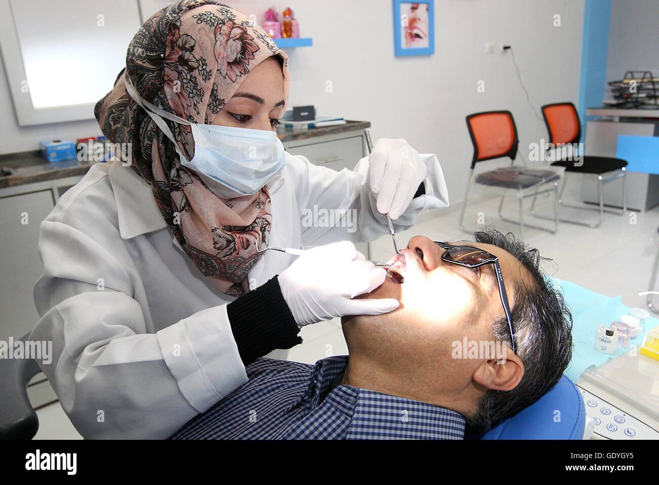 A young female dentist in her office in Gaza City. The Gaza Strip is a coastal region on the