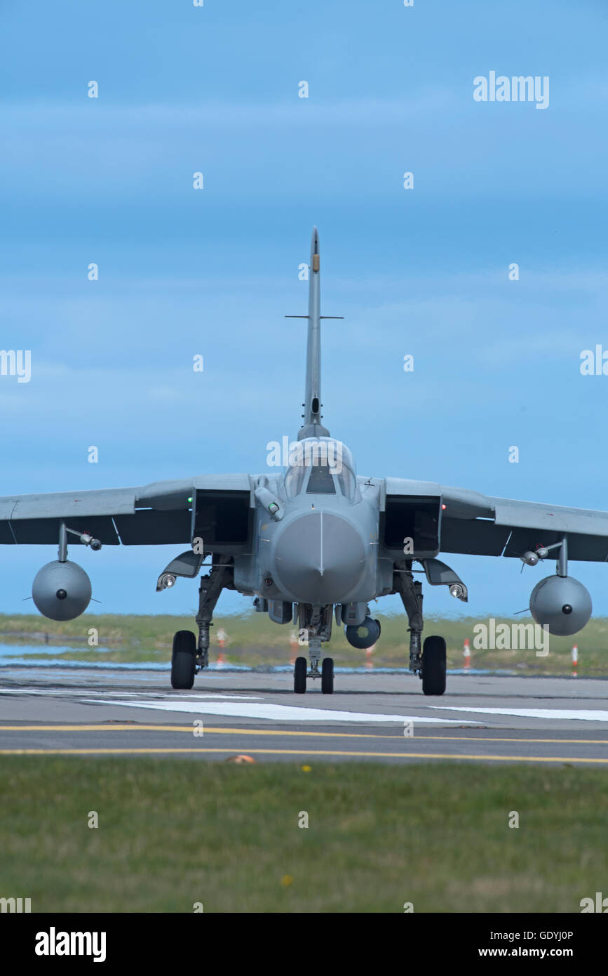 An RAF GR4 Tornado on the perimeter taxiway at the Lossiemouth home base in Scotland.  SCO 10,779. Stock Photo