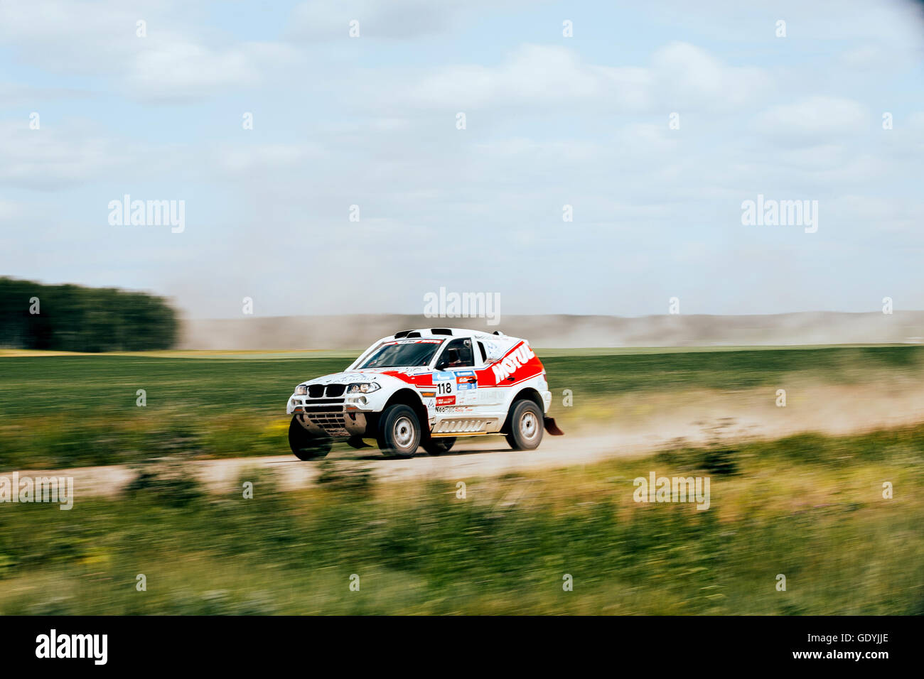 rally car rides at high speed on road during Silk way rally Stock Photo