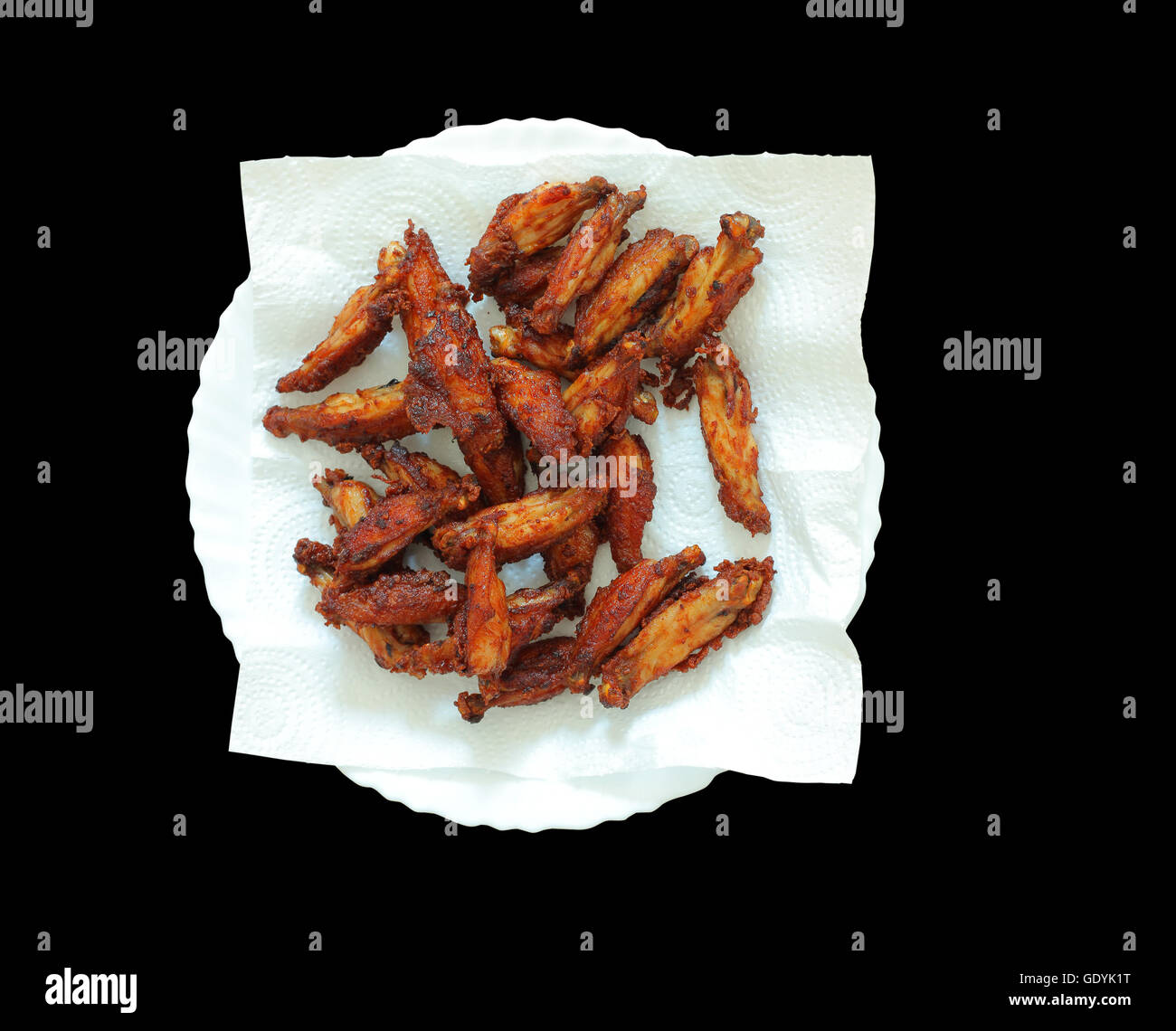 Fried chicken wings burn isolated on black background Stock Photo Alamy