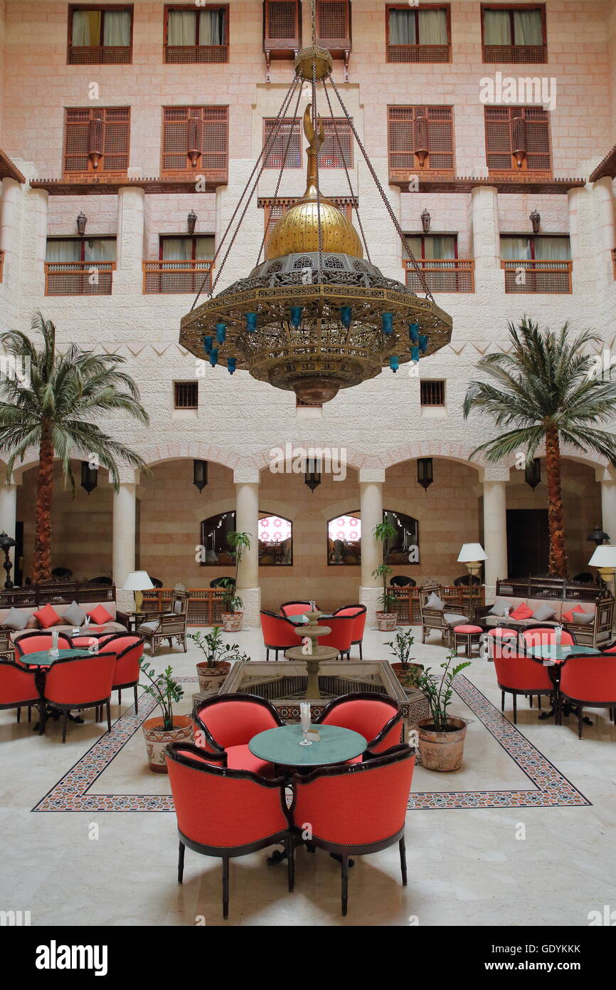 The magnificent courtyard atrium of the Movenpick Hotel in Petra, Jordan, located at the entrance of the site Stock Photo