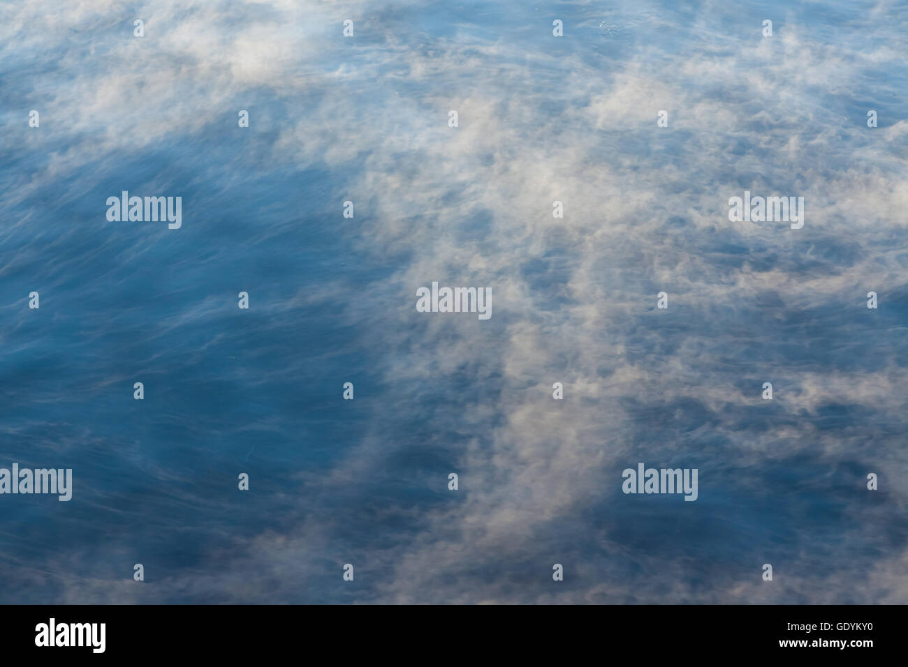 Water vapor on surface of cold icy water at sunny cold winter day Stock Photo