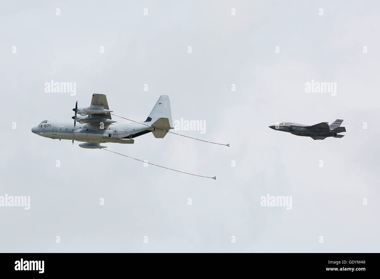 KC-130J Hercules BH-8071 flies in formation with F-35B Lightning II VM-18 at the 2016 Royal International Air tattoo Stock Photo