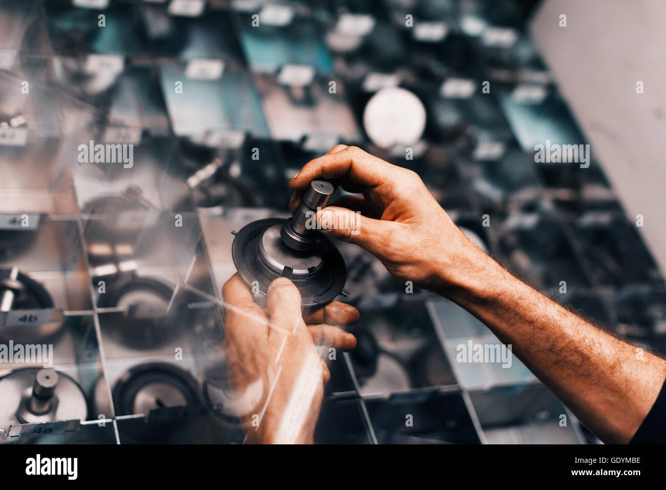 Worker assembling part in steel factory Stock Photo