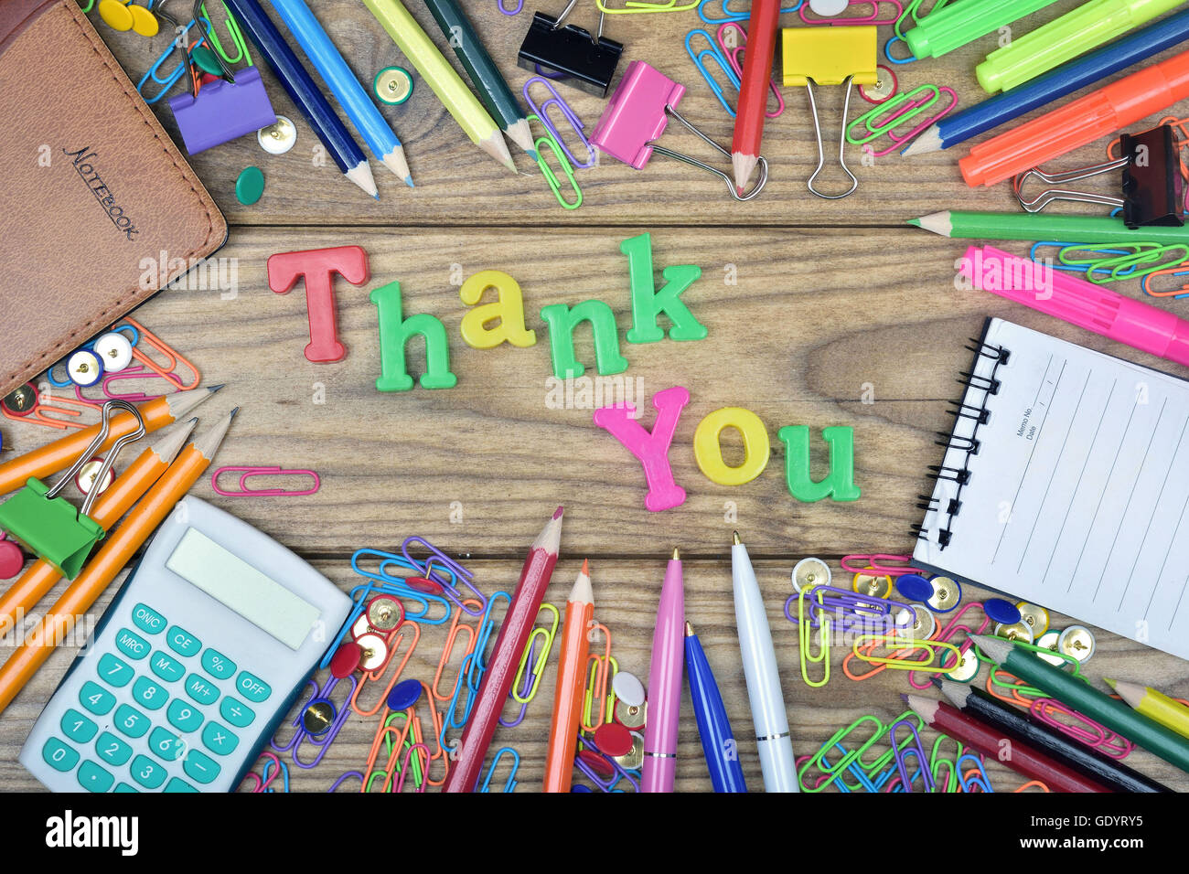 Thank You word and office tools on wooden table Stock Photo - Alamy