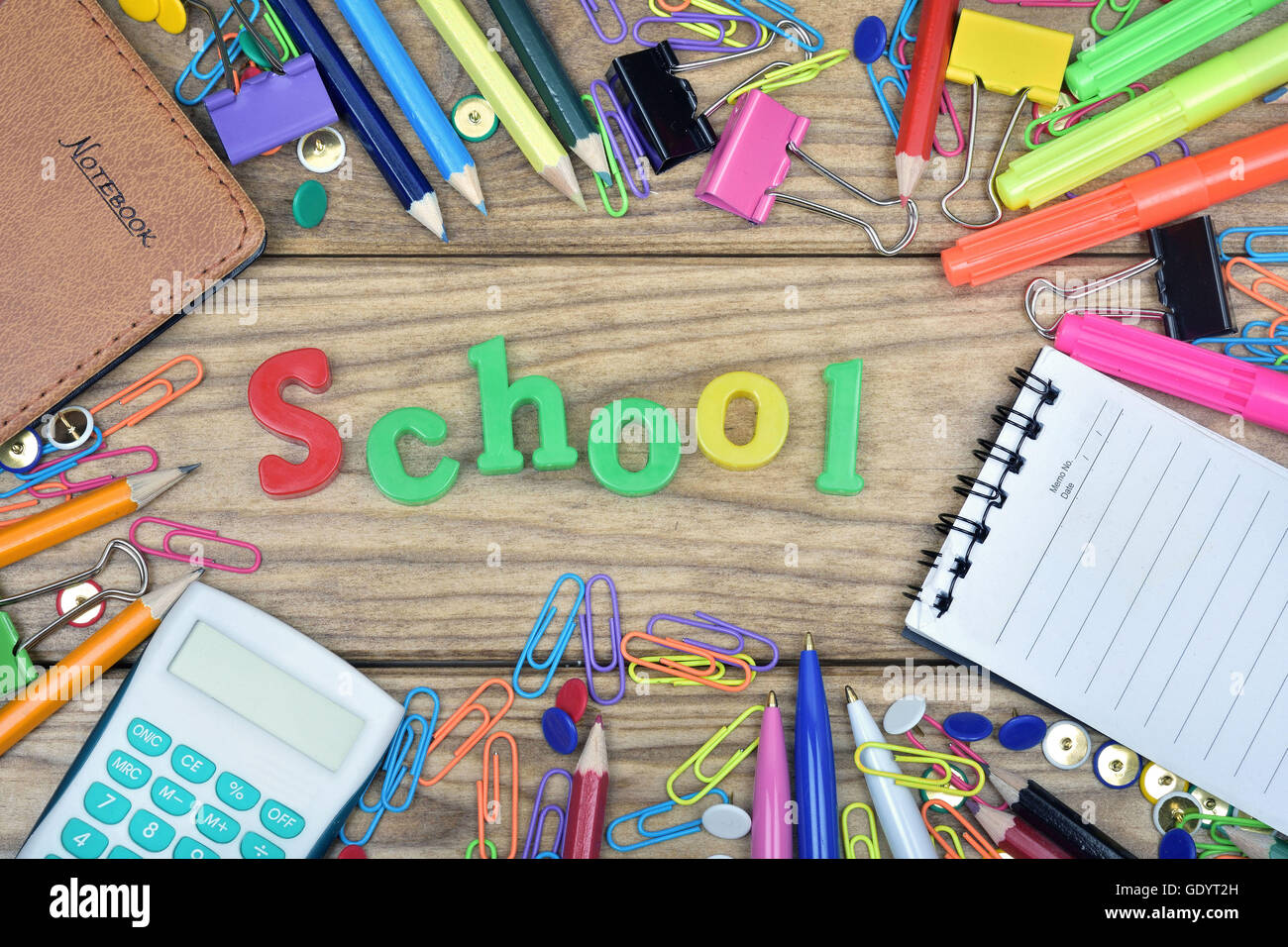 School word and office tools on wooden table Stock Photo