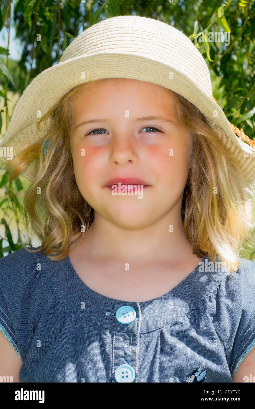 Little girl wearing straw hat Stock Photo Alamy