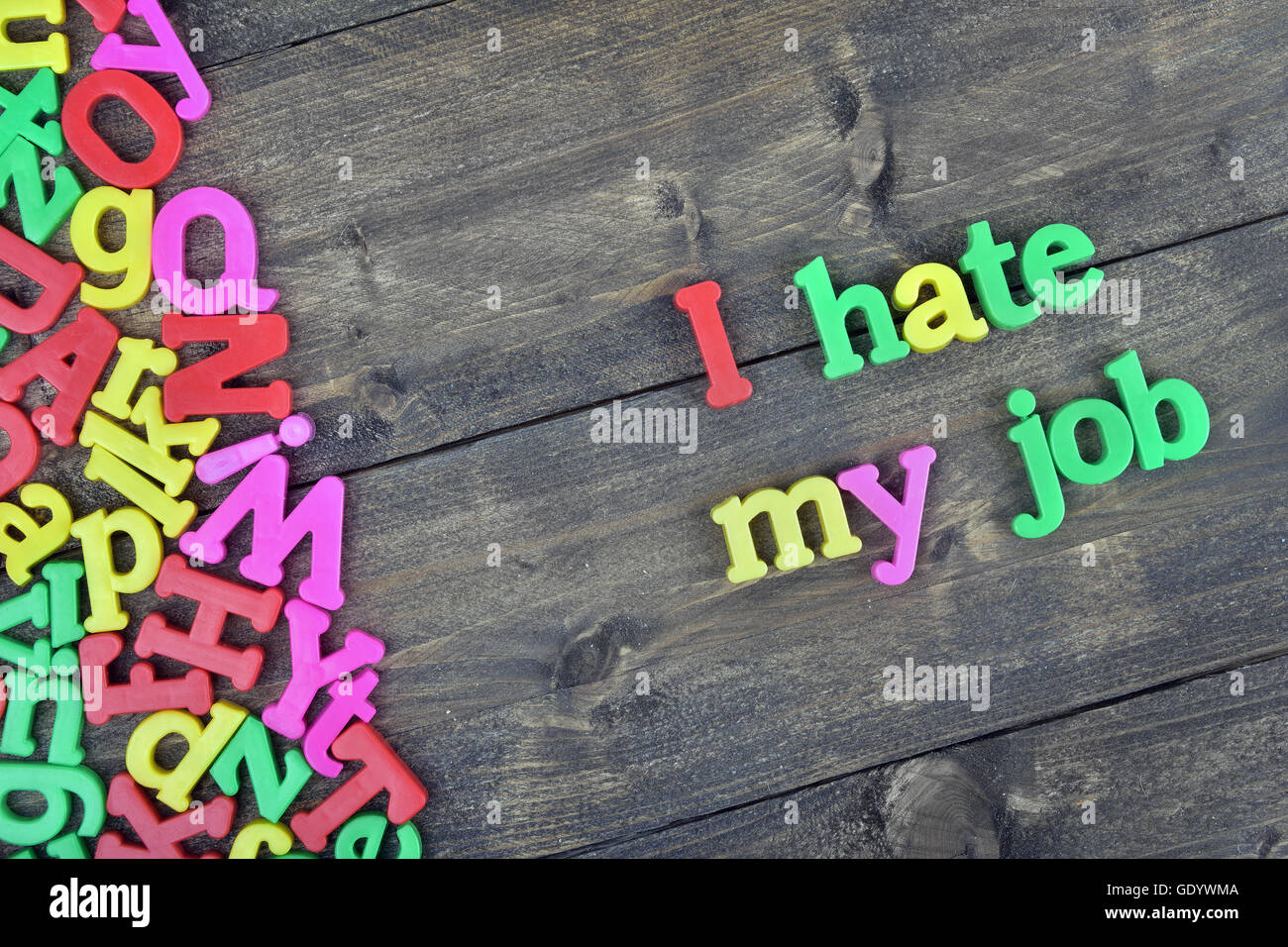 I hate my job word on wooden table Stock Photo