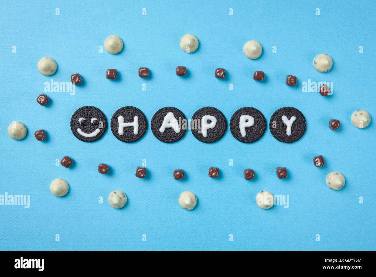 Typographical word of HAPPY made of chocolates and cookies Stock Photo