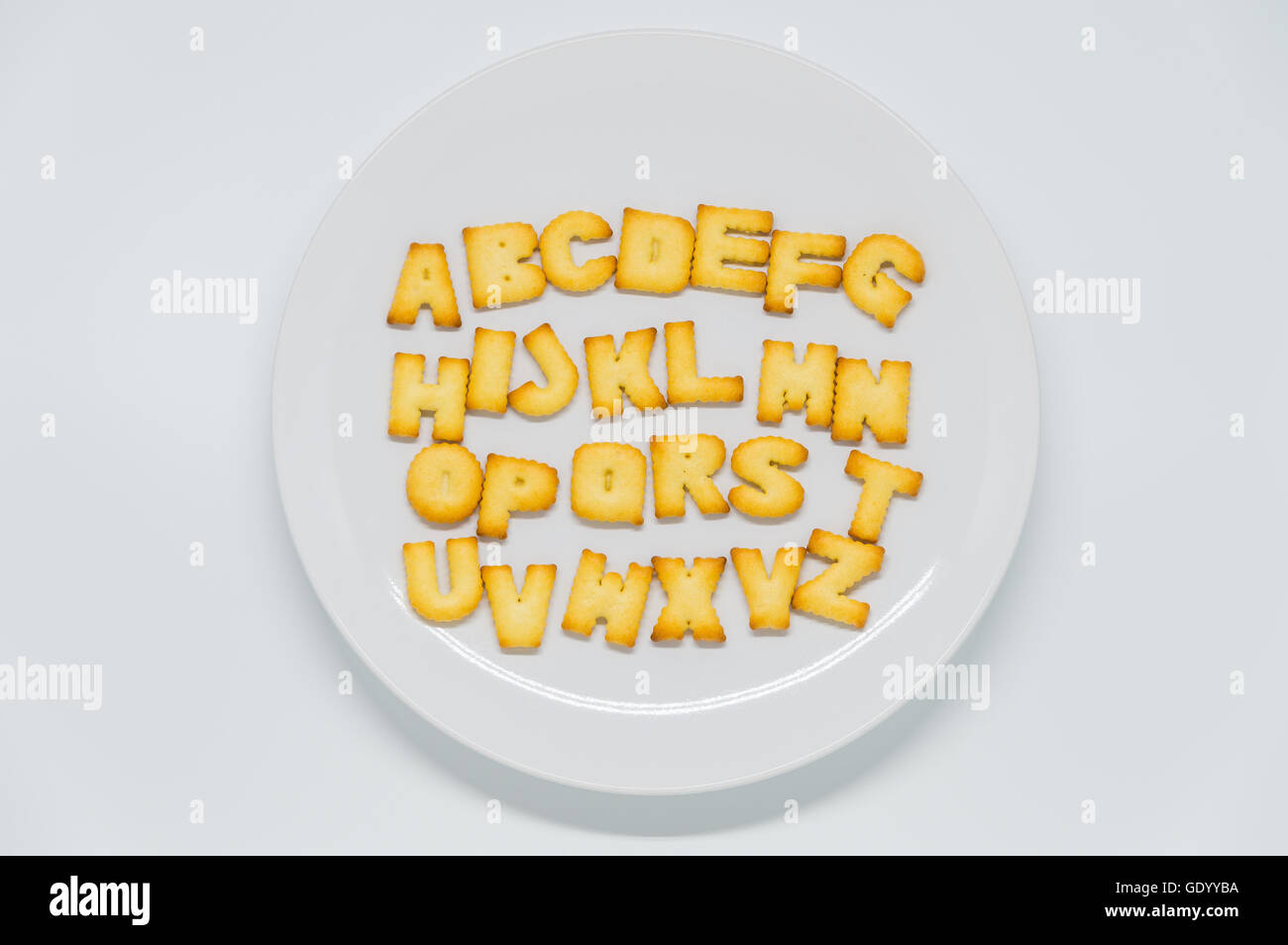 Square Letters Cracker Alphabet shape cracker on dish with white background Stock Photo - Alamy