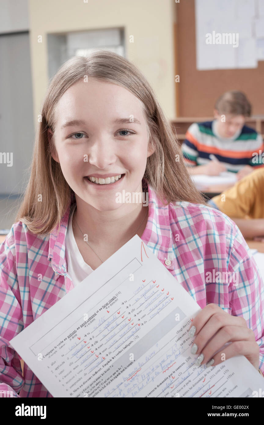 Happy university student with her test result, Bavaria, Germany Stock Photo