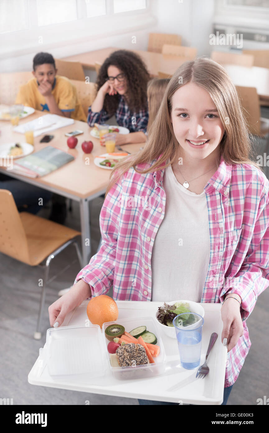 Students having lunch in canteen hires stock photography and images
