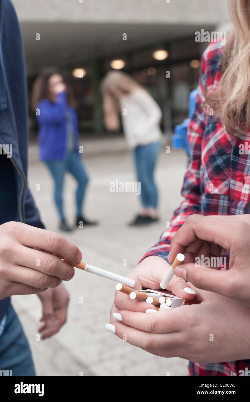 university students smoking cigarettes in campus, Bavaria, Germany Stock Photo