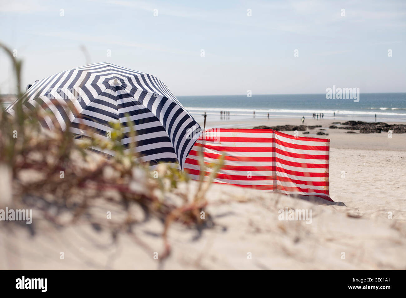 Striped Sunshade on the beach, Viana do Castelo, Norte Region, Portugal Stock Photo