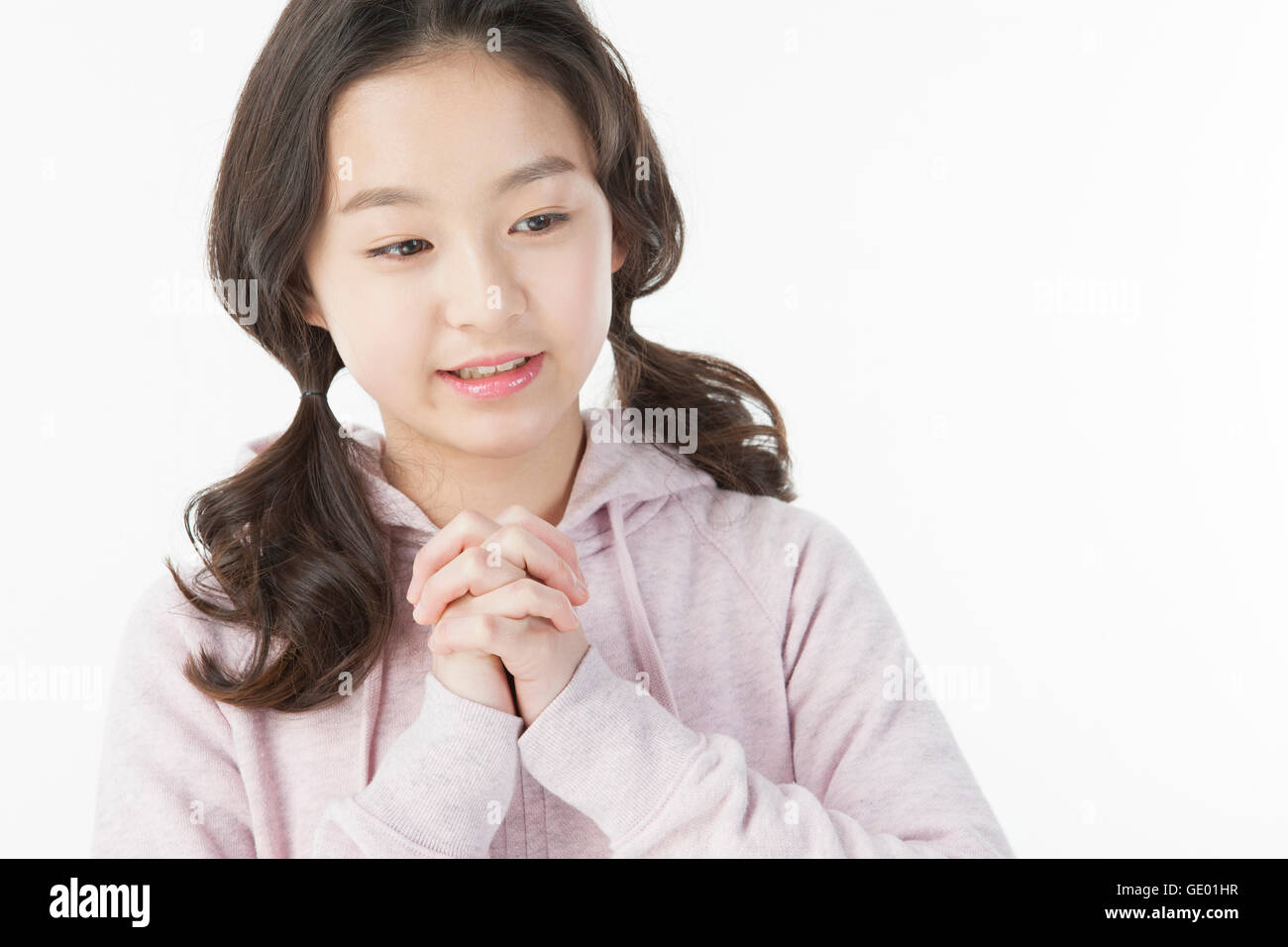 Portrait of smiling school girl folding hands Stock Photo Alamy