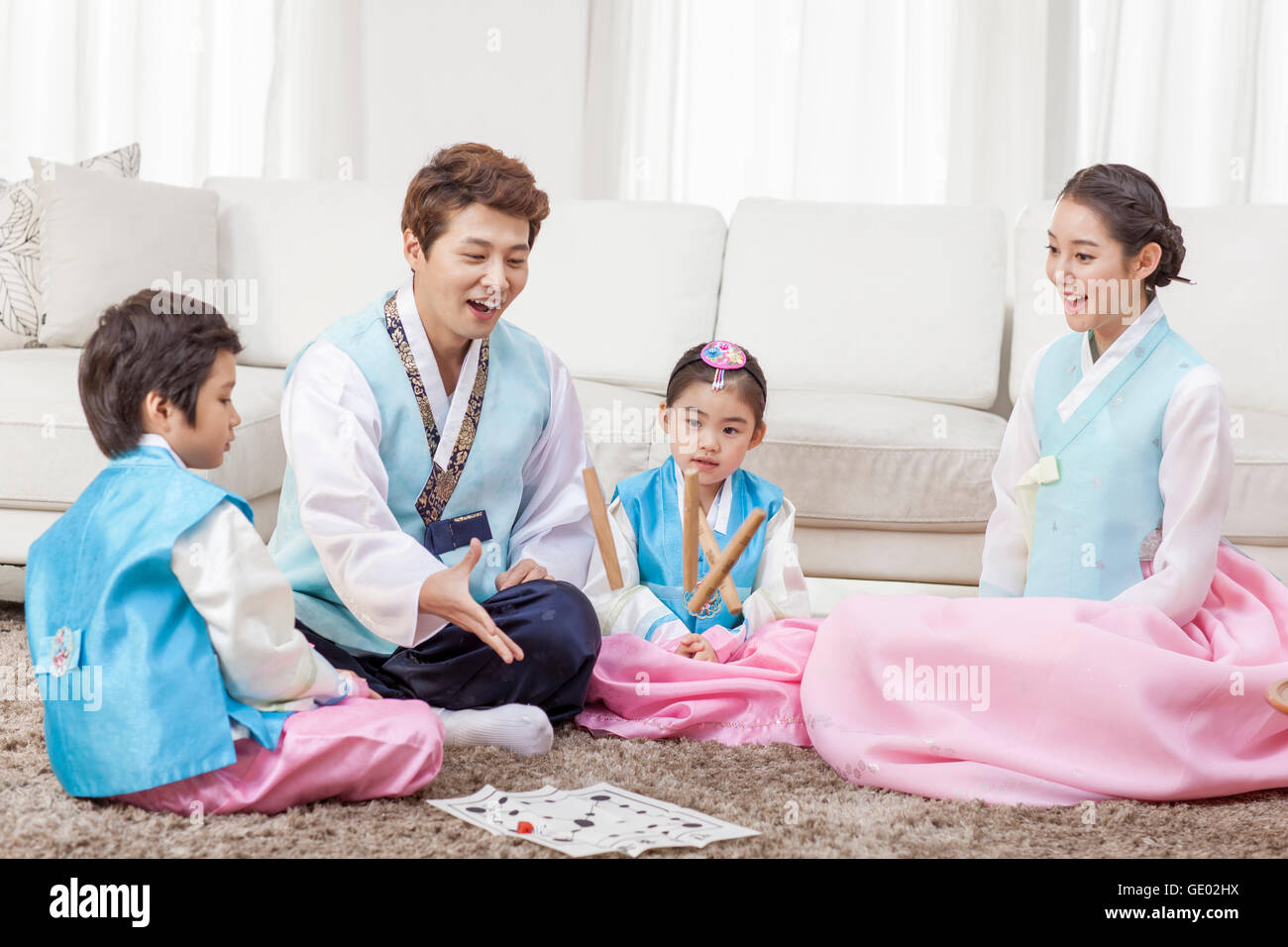 Harmonious family playing yut hires stock photography and images Alamy