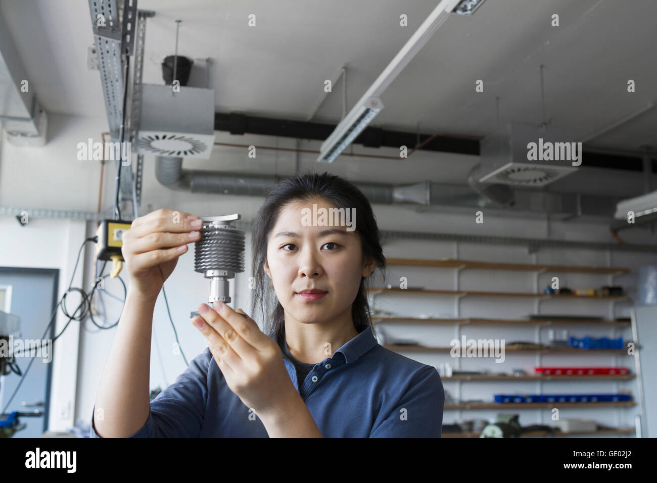 Young female engineer working in an industrial plant, Freiburg im Breisgau, Baden-Württemberg, Germany Stock Photo