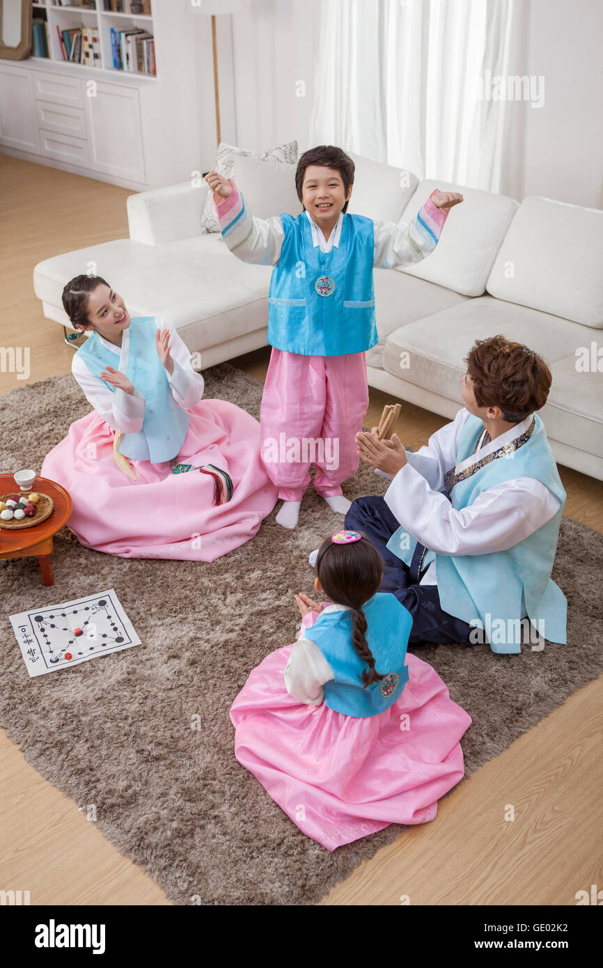 Harmonious Korean family having a food time on traditional Korean