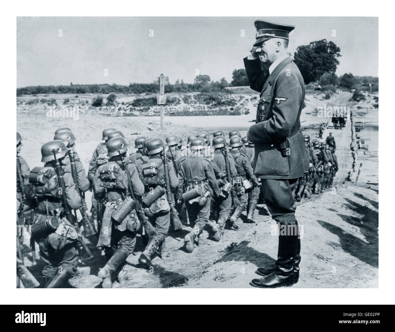 1939 GERMAN NAZI OCCUPATION  INVASION POLAND Adolf Hitler saluting marching Wehrmacht troops during occupation of Poland WW2 Stock Photo