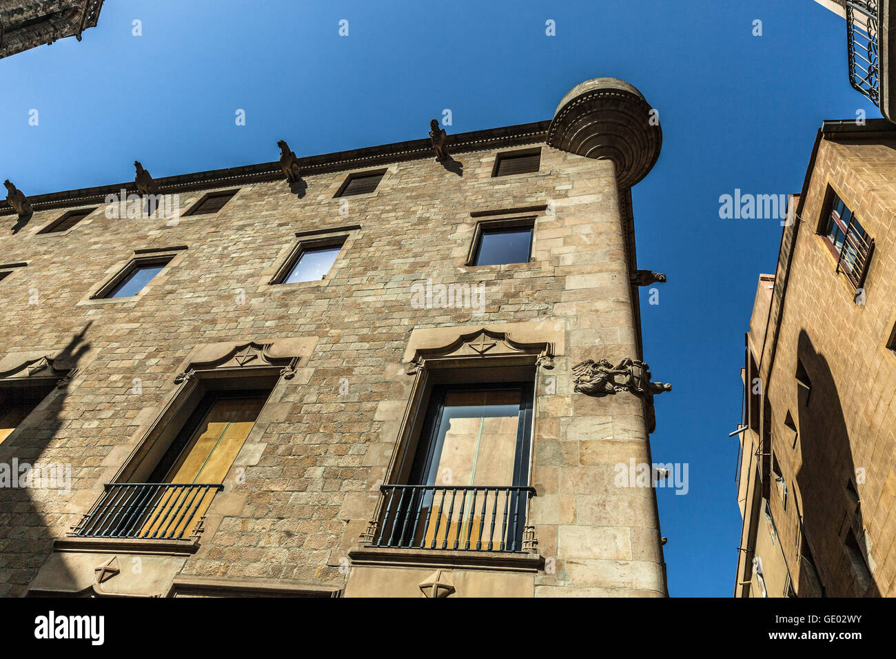Low angle view of old building tops at Gothic Quarter, Barcelona, Catalonia, Spain. Stock Photo