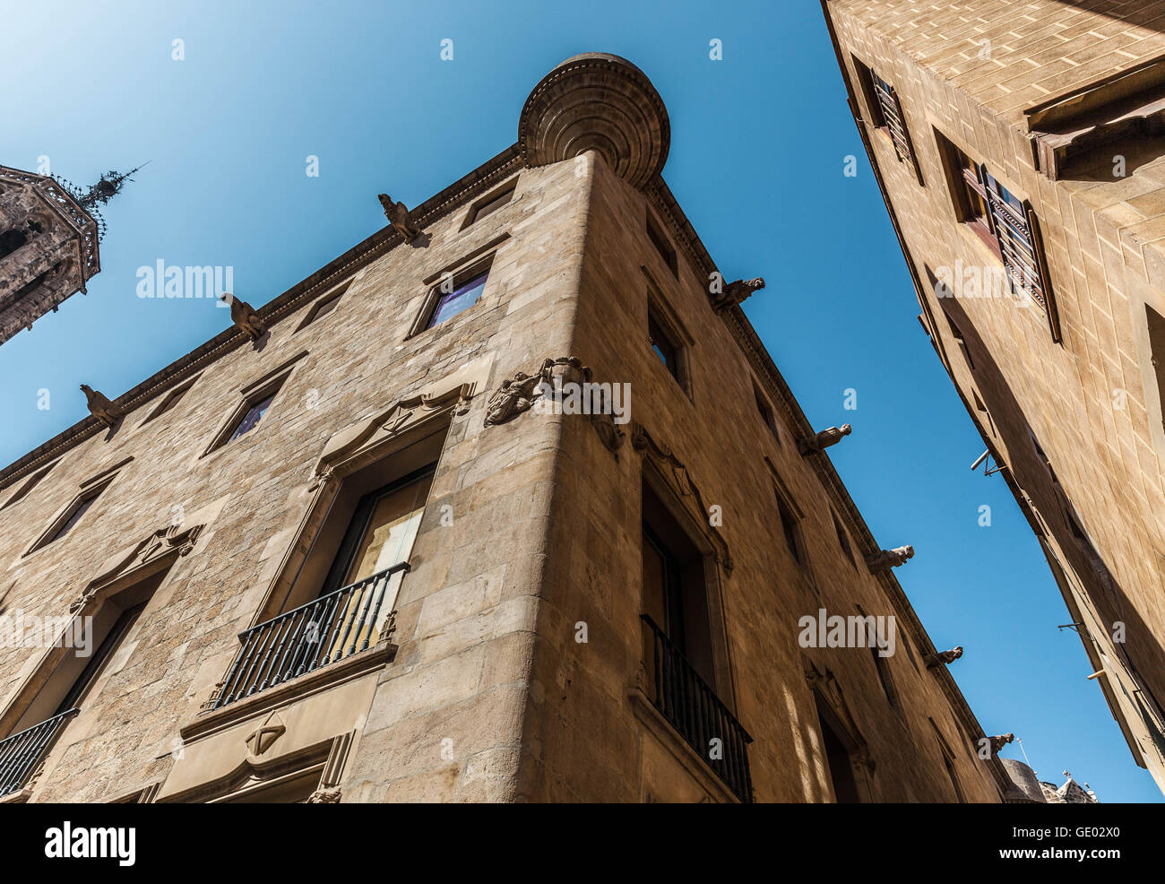 Low angle view of old building tops at Gothic Quarter, Barcelona, Catalonia, Spain. Stock Photo