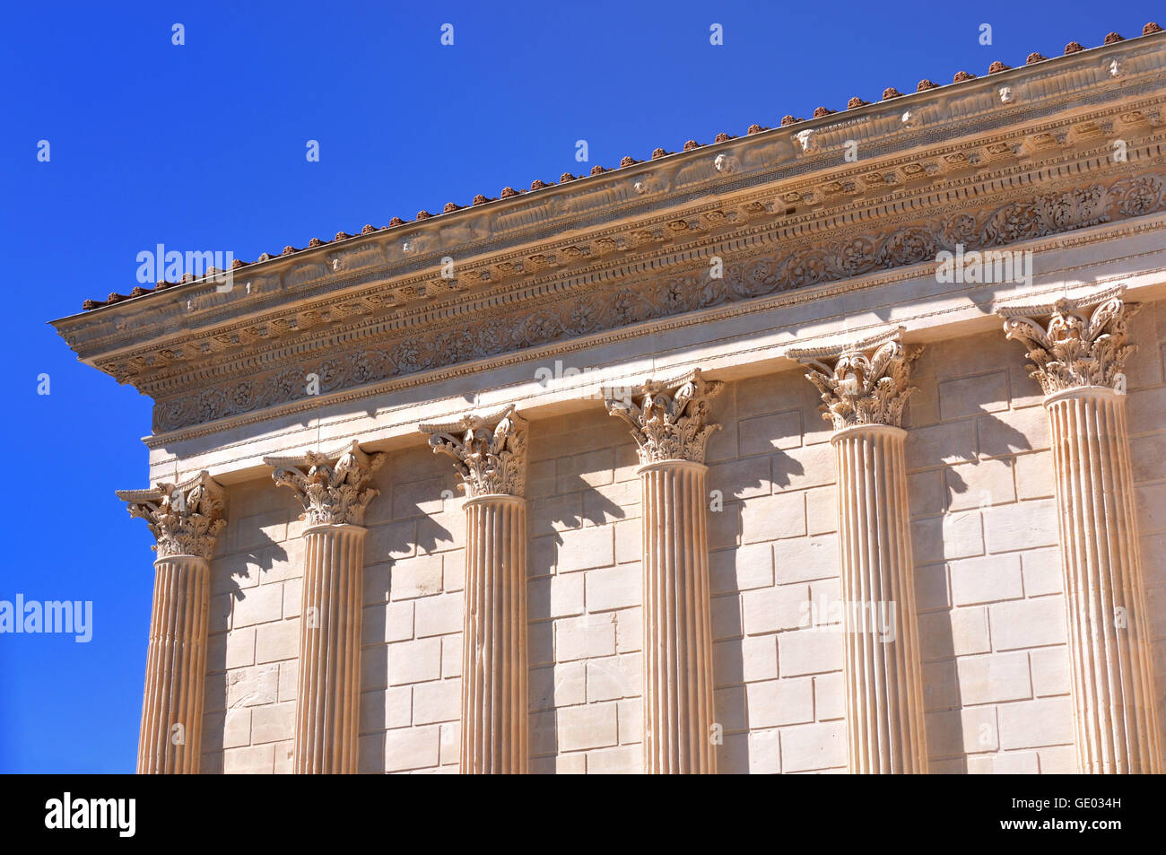 The Maison Carree is an ancient building in Nimes, showing one of the best preserved Roman temple facades. Stock Photo