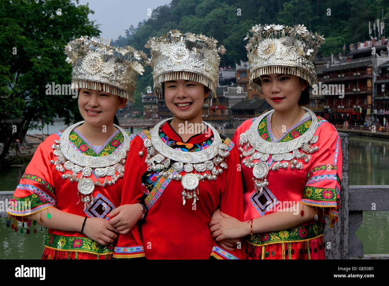 Three young woman dressing with Miao costumes, Fenghuang Town, China Stock Photo