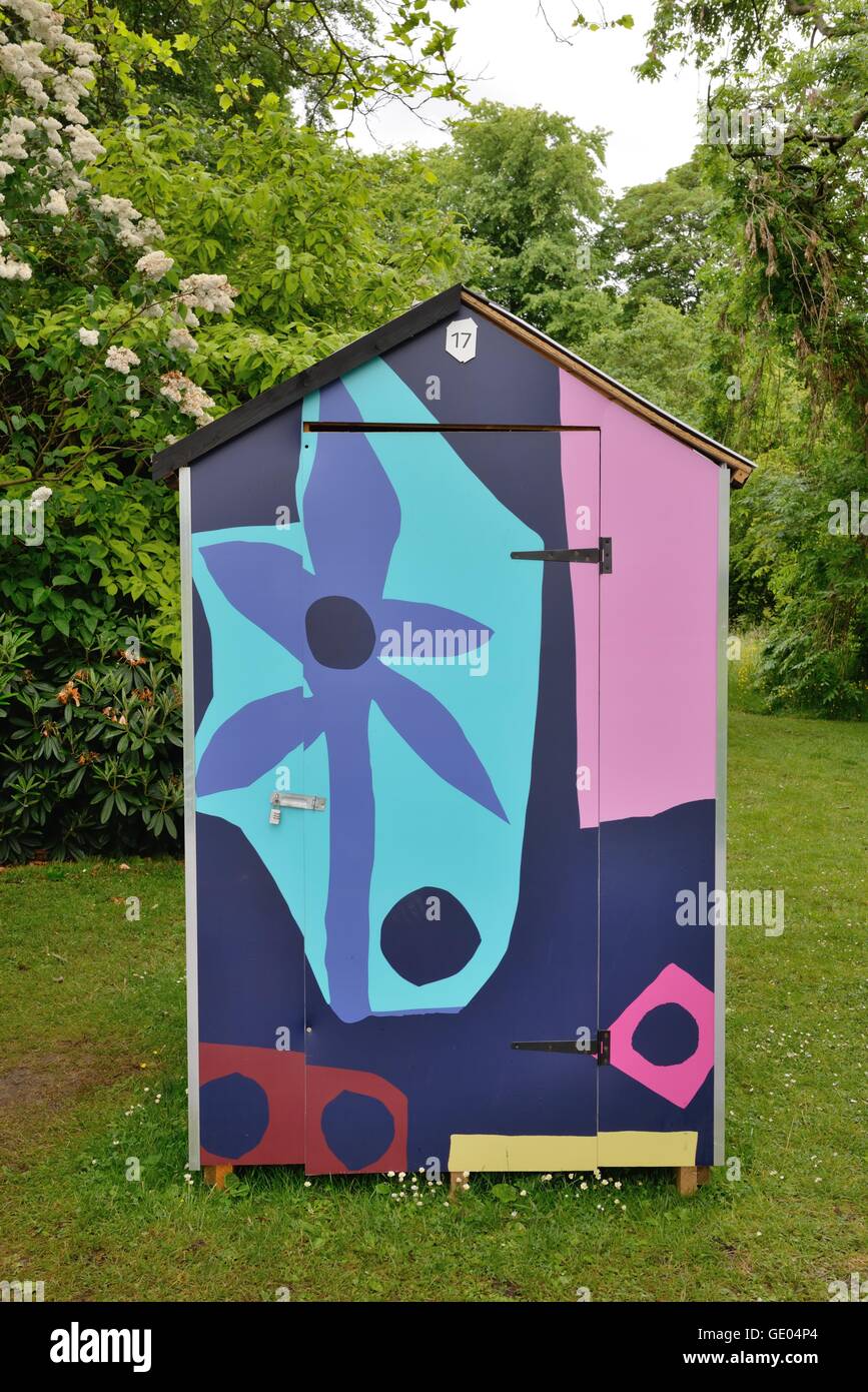 Colourful garden shed as part of  'The Ideal Hut Show' in Glasgow's botanic gardens, Scotland, UK Stock Photo
