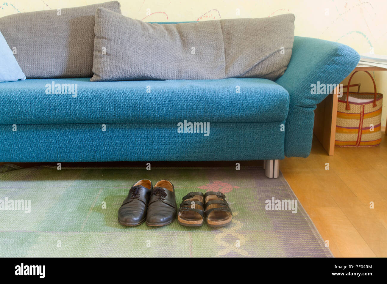 Sofa in living room with shoes Stock Photo