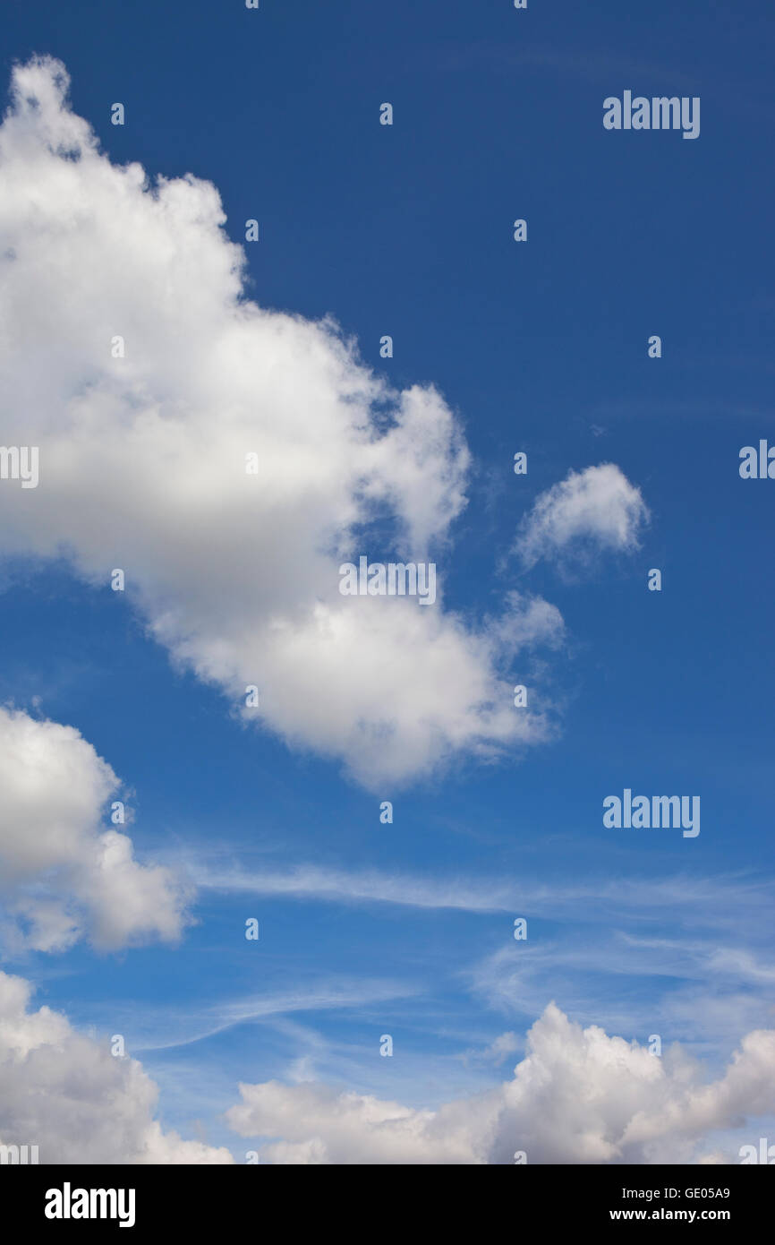 Summer background with fluffy white clouds on a deep blue sky Stock ...