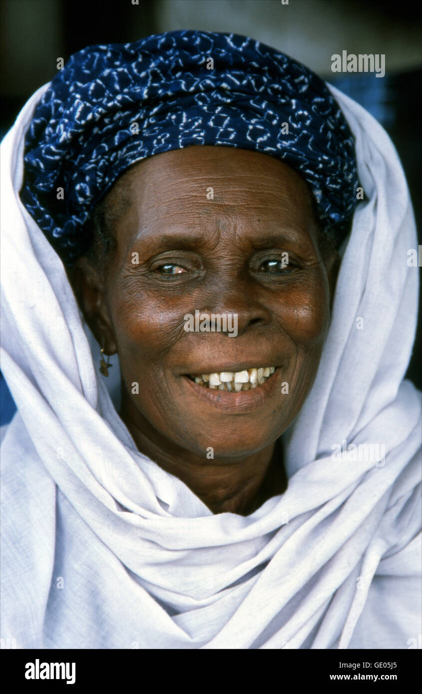 Portrait of a Yoruba woman selling indigo cloth in the market at