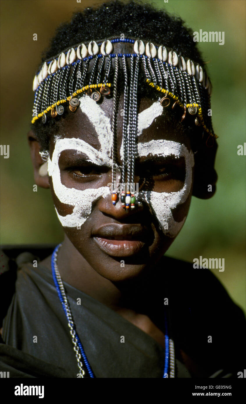 Young Maasai girl in a ceremony connected to puberty rites. Maasai Mara Game Reserve, Kenya. Stock Photo