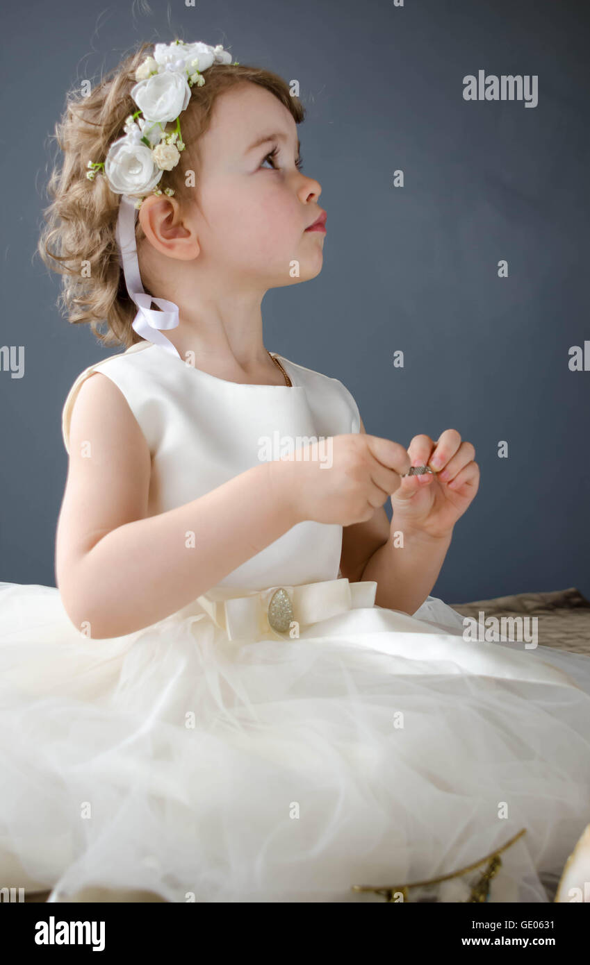 little beautiful baby girl in white dress Stock Photo - Alamy