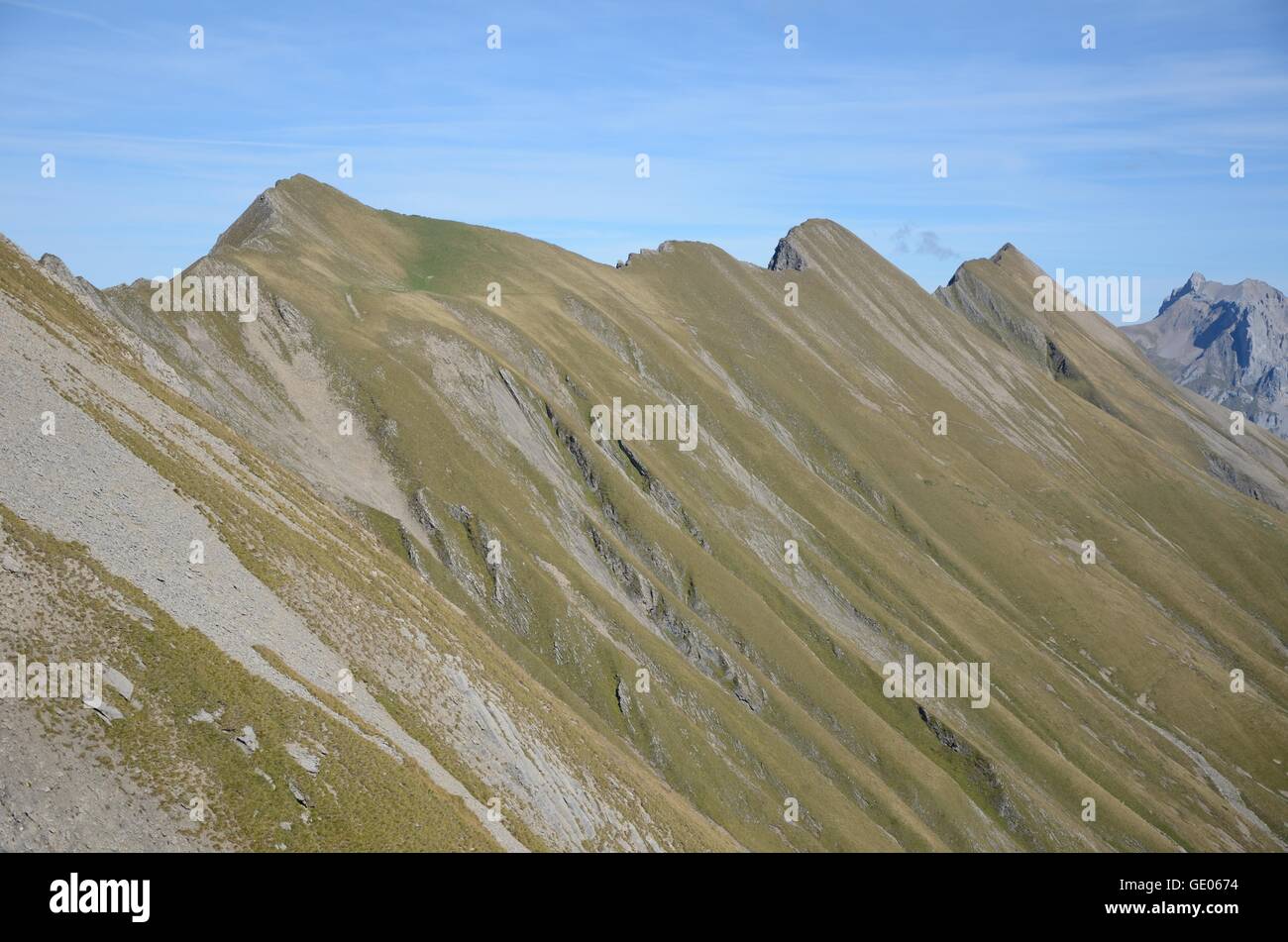 Crest, ridge, Swiss, alps, rocks, stones, grass, steep, cliff Stock Photo