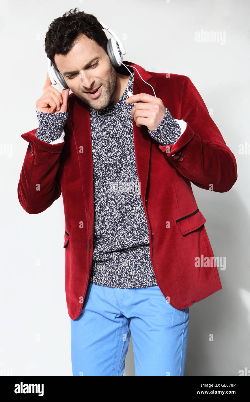 Handsome man listening to music Stock Photo