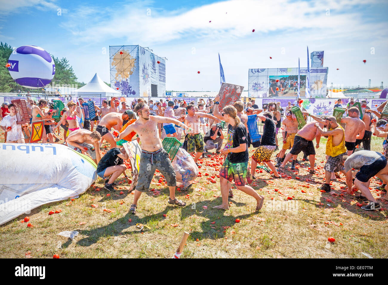 Tomato fight on the 21th Woodstock Festival Poland (Przystanek Woodstock). Stock Photo