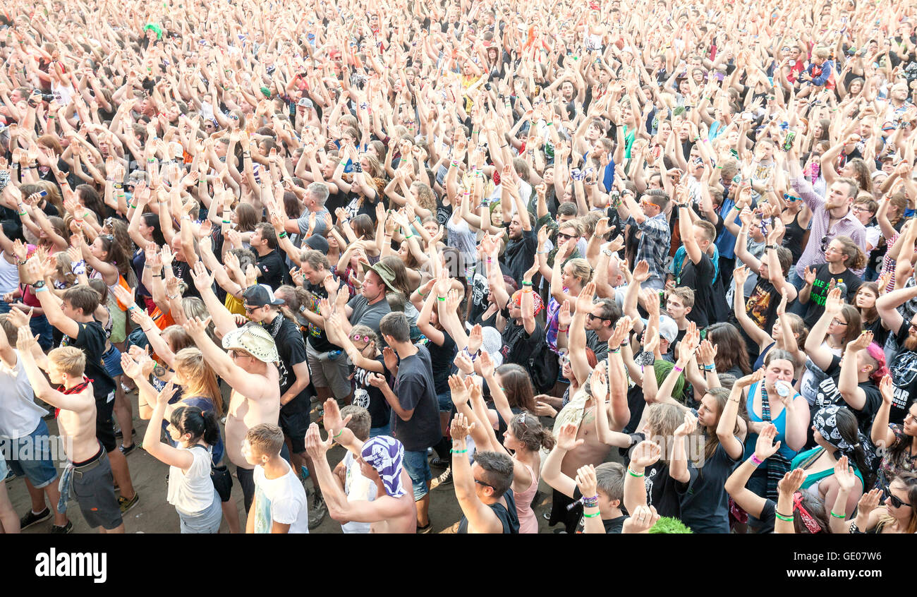 Applauding people during concert on the 21th Woodstock Festival Poland. Stock Photo