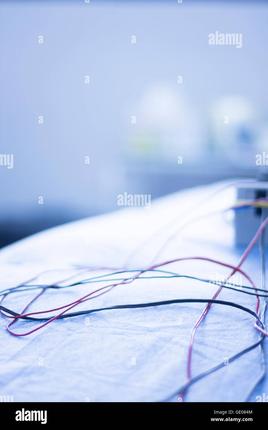 Dry needling electroacupunture cables connecting machine to needles used by acupunturist on