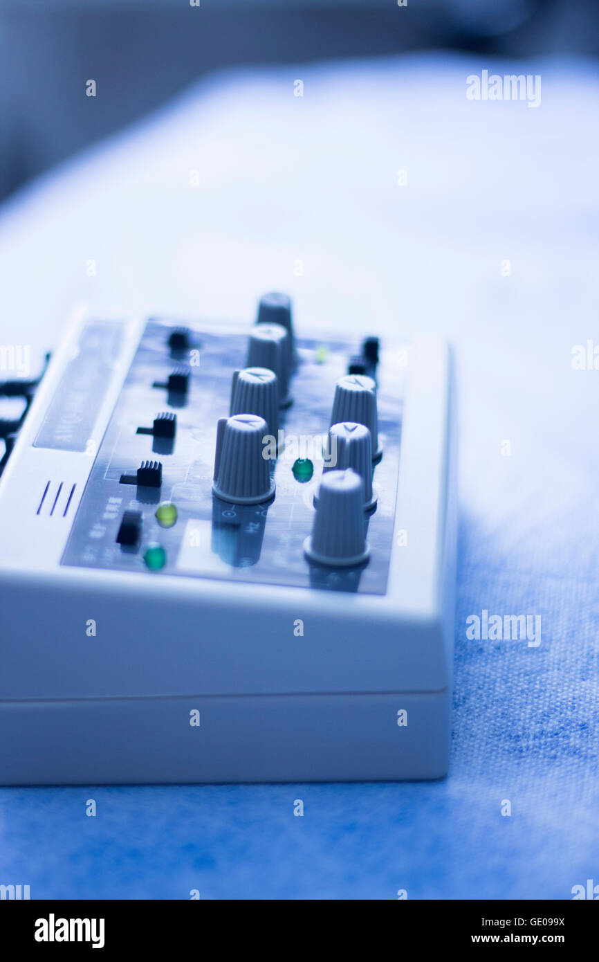 Dry needling electroacupunture cables connecting machine to needles used by acupunturist on