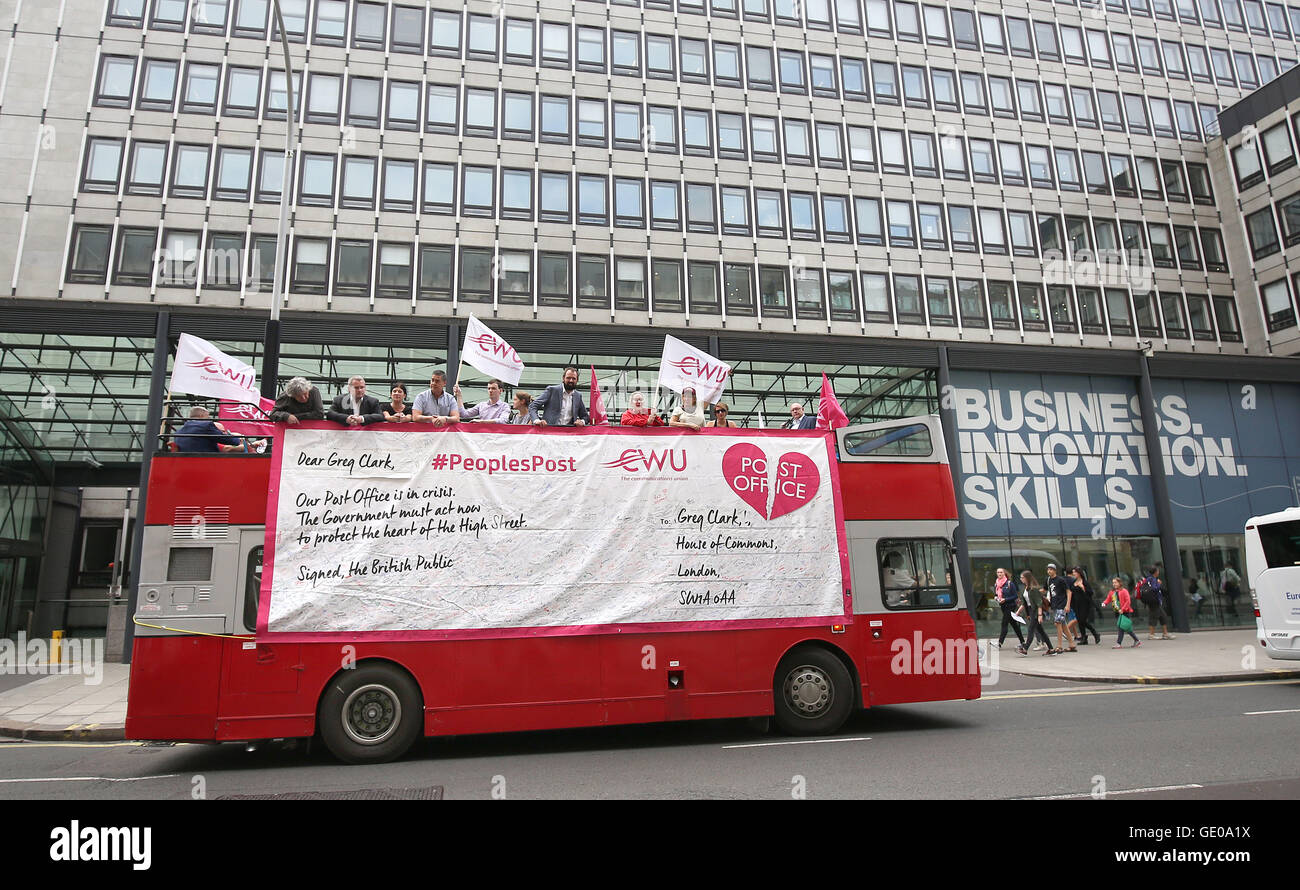 Protesters on board a bus outside the headquarters of the Business  Department in London, as postal workers delivered a warning to the  government that Post Office was in "crisis" because of closures